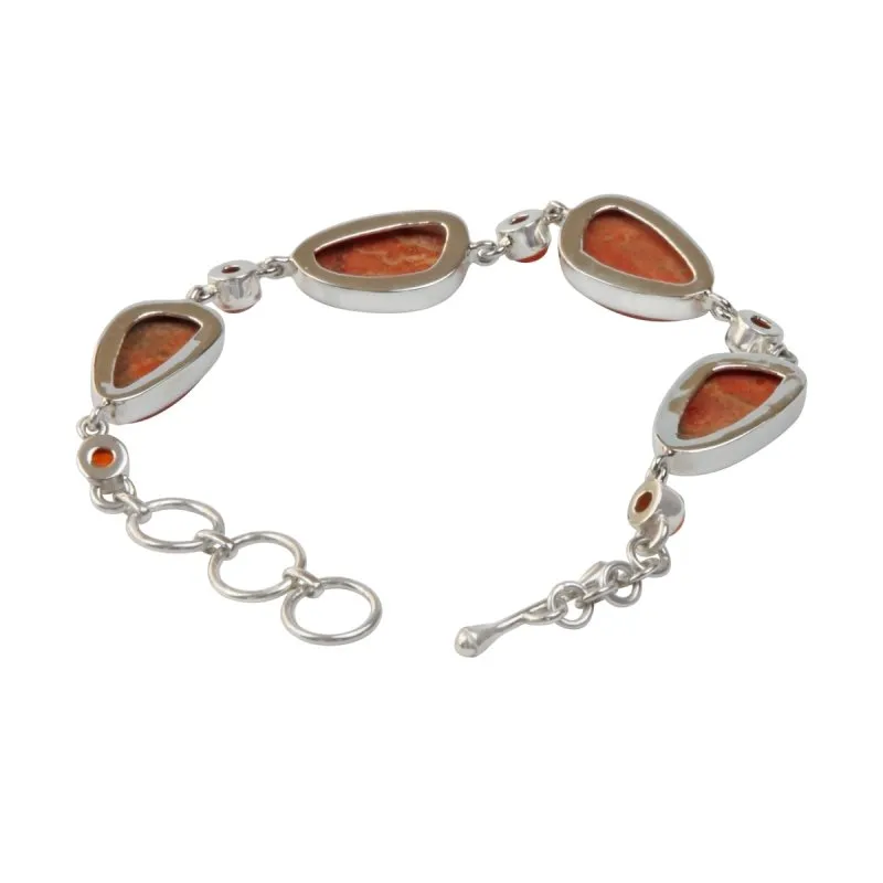 An Elegant Design with 4 Beautiful Sponge Corals set in a Sterling Silver Bracelet and Accented with Small Round Carnalian Gems