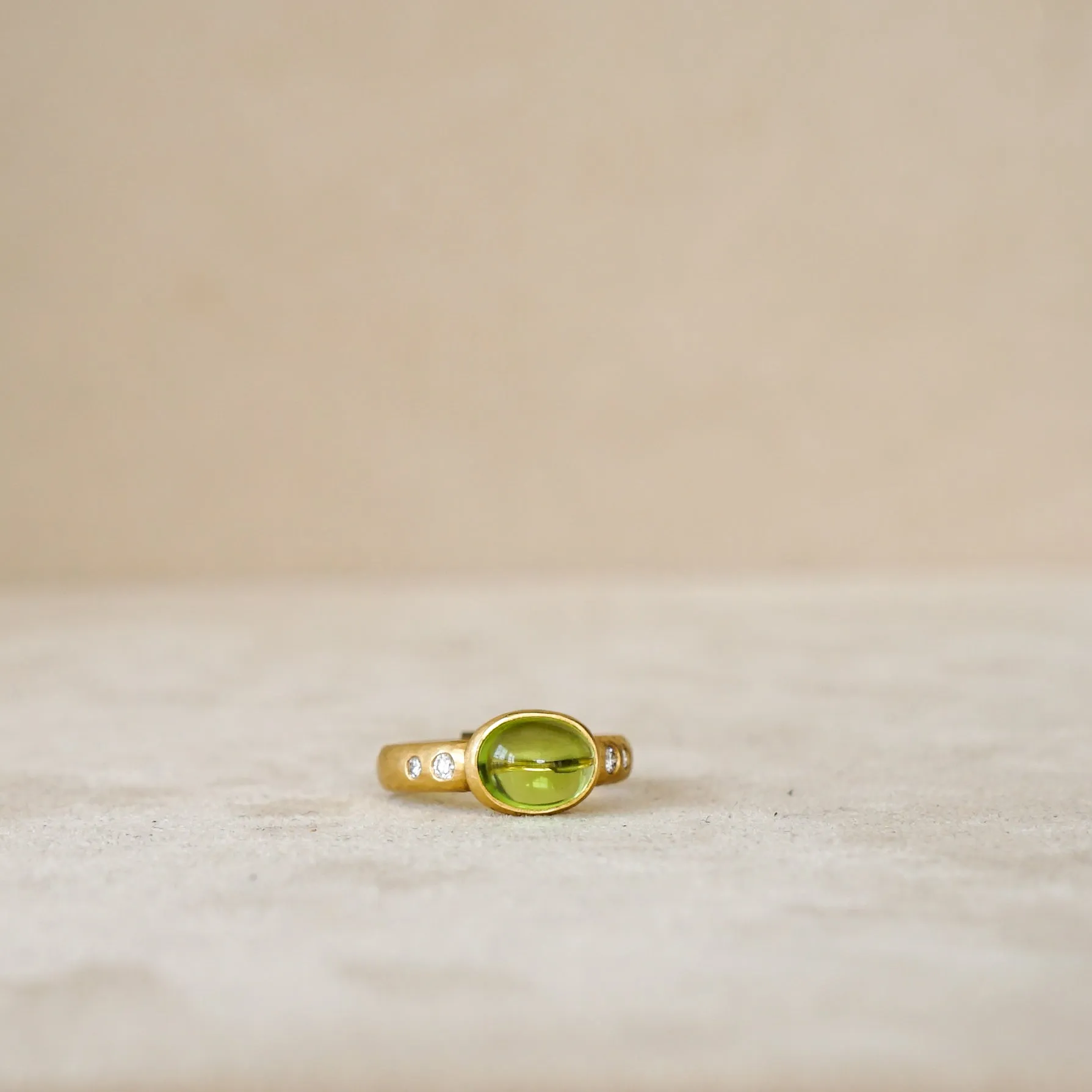 Peridot Cabochon Ring with Diamond Band
