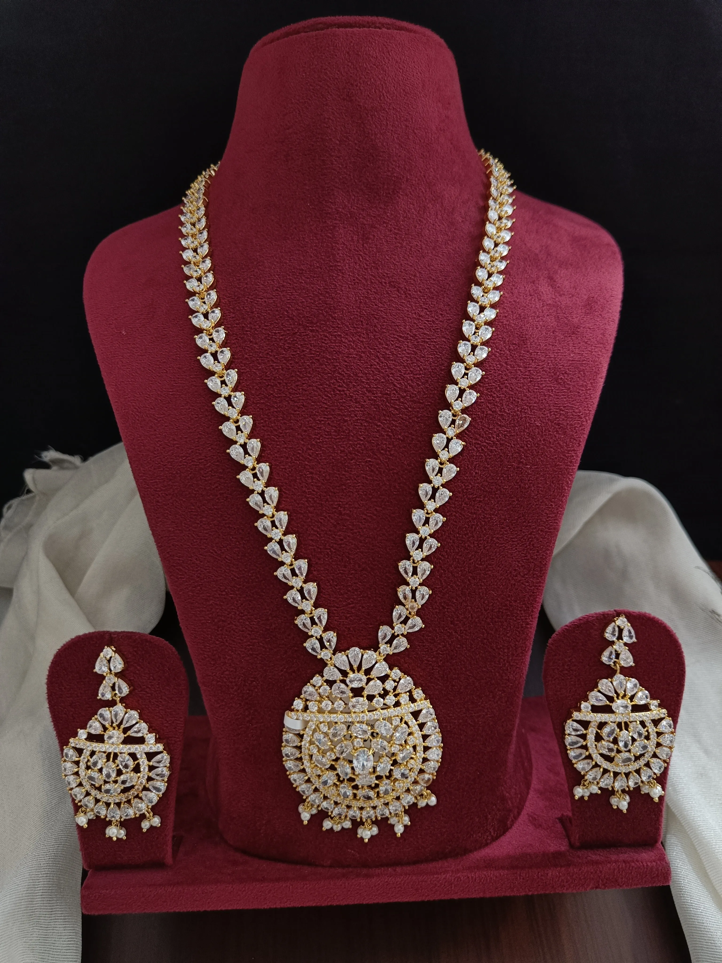 Zircon Long Necklace Set Having Half White Pearls