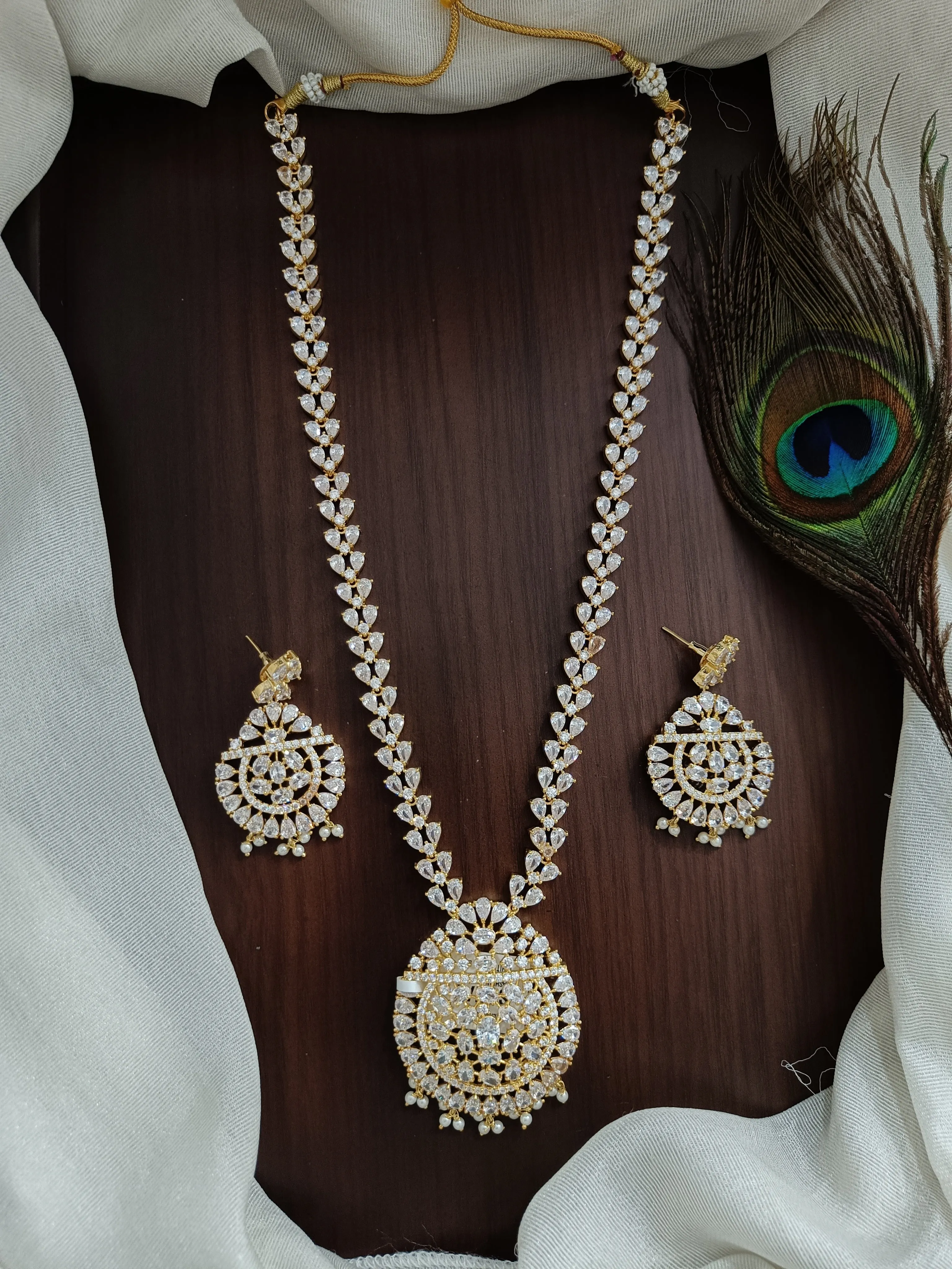 Zircon Long Necklace Set Having Half White Pearls