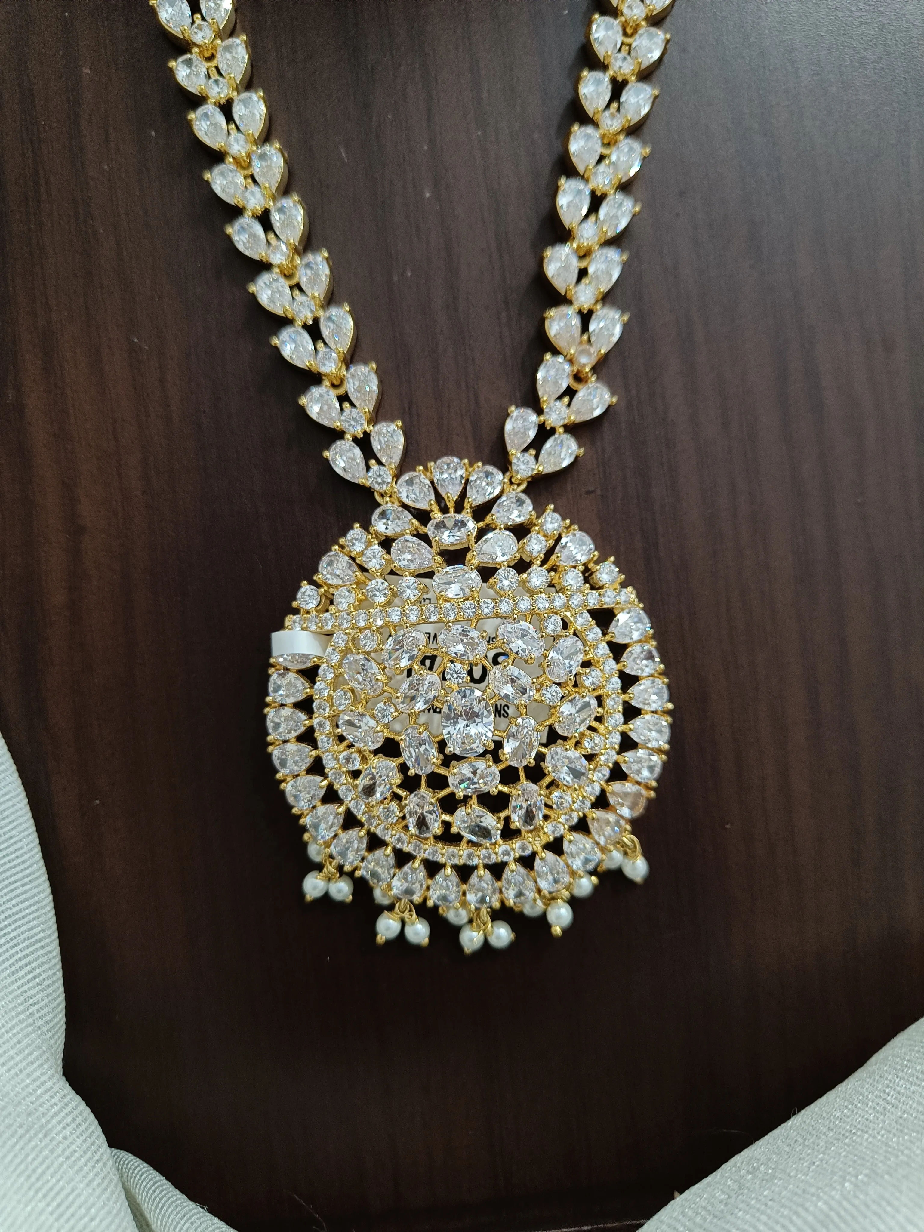 Zircon Long Necklace Set Having Half White Pearls